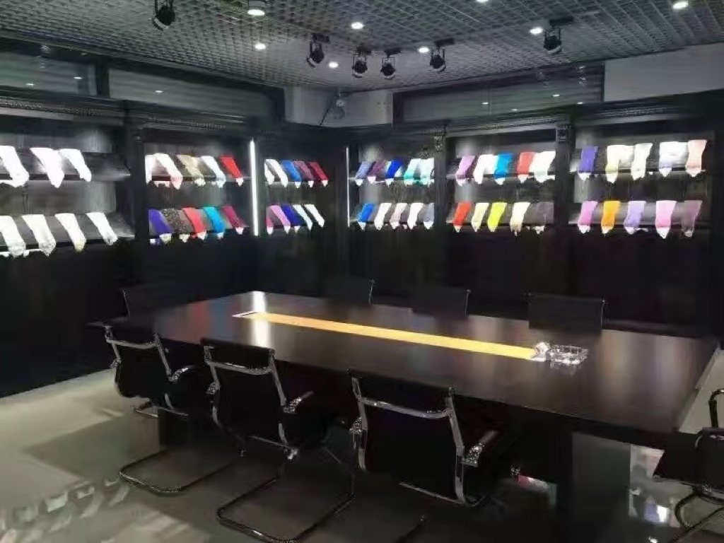 Dyeing sample room with colour samples around a meeting table